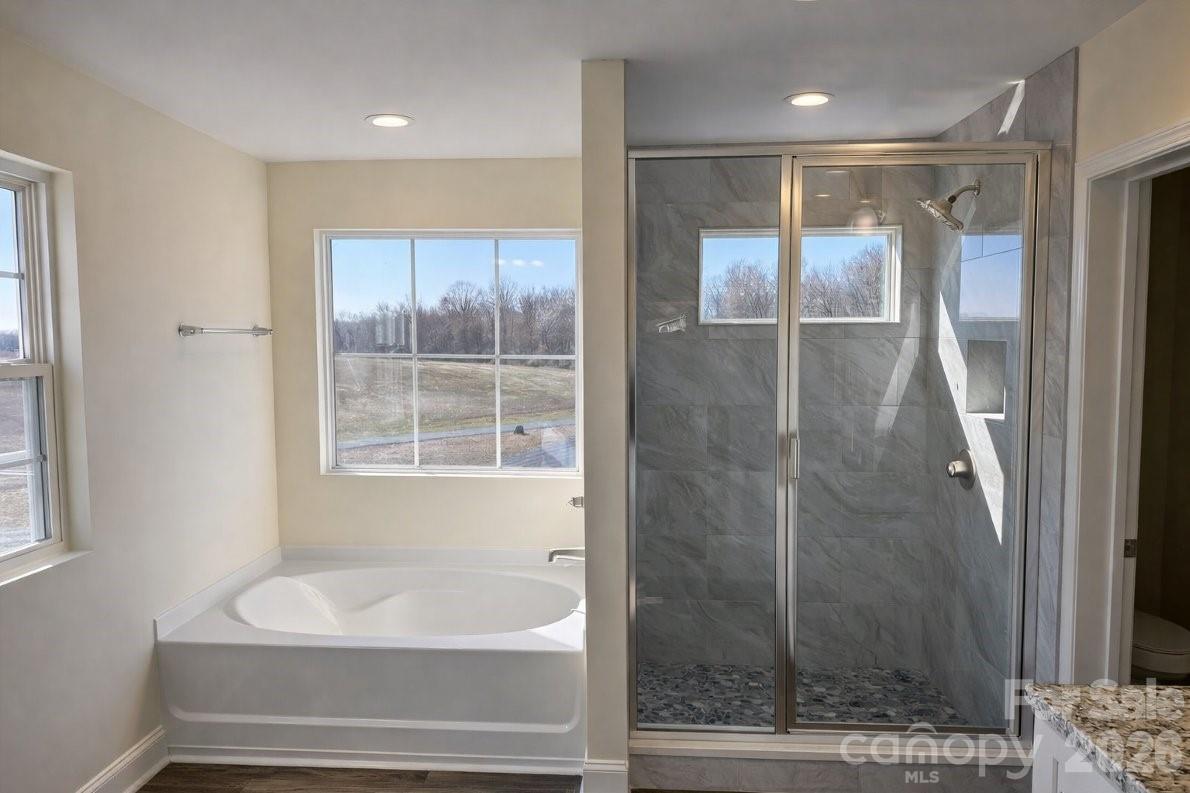 1022 Heath Helms Road Monroe, NC 28110 - Photo 6 of 10 a bathroom with a shower and a sink