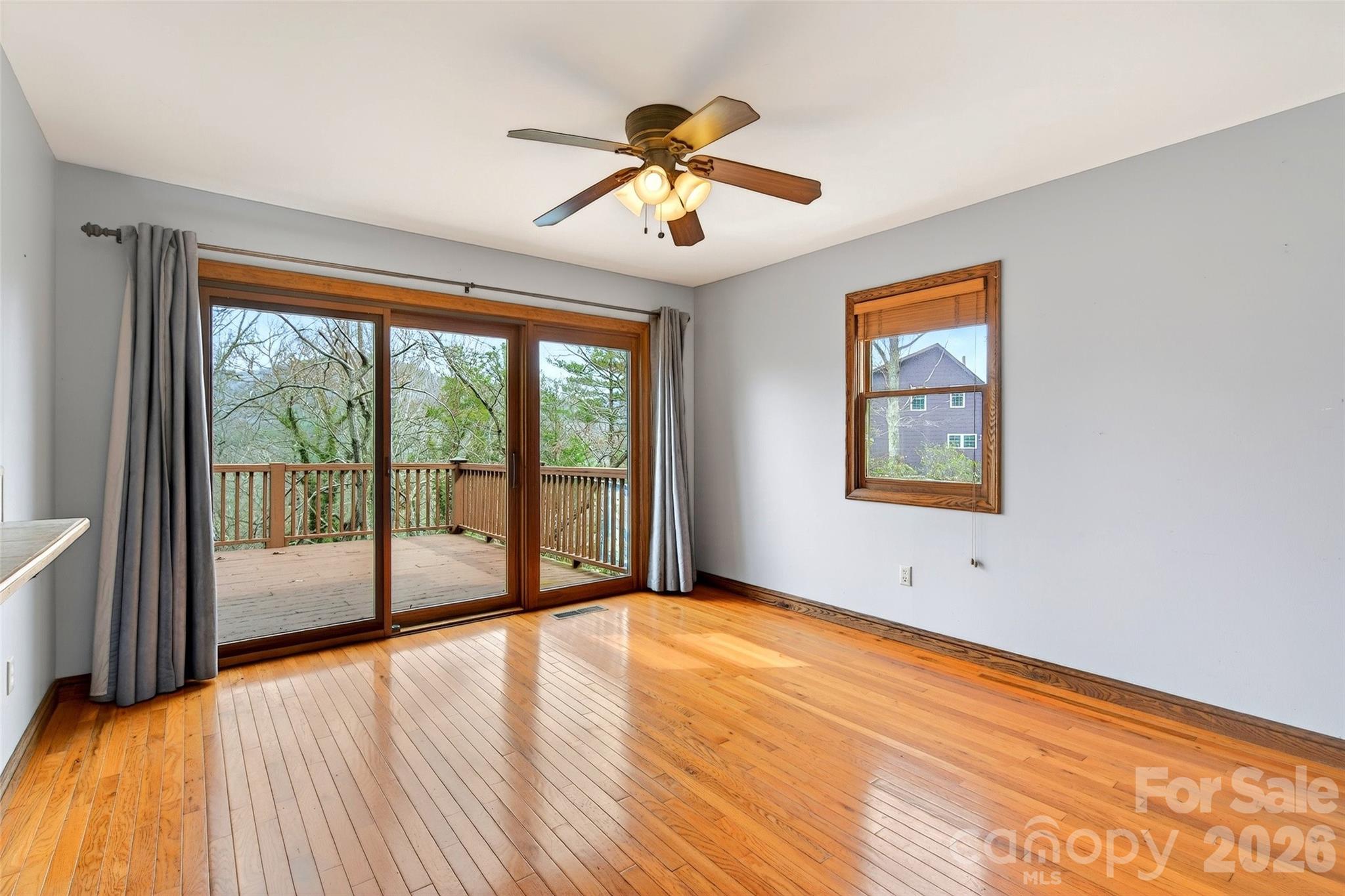 169 Hilltop Road Black Mountain, NC 28711 - Photo 14 of 48 a view of an empty room with a window