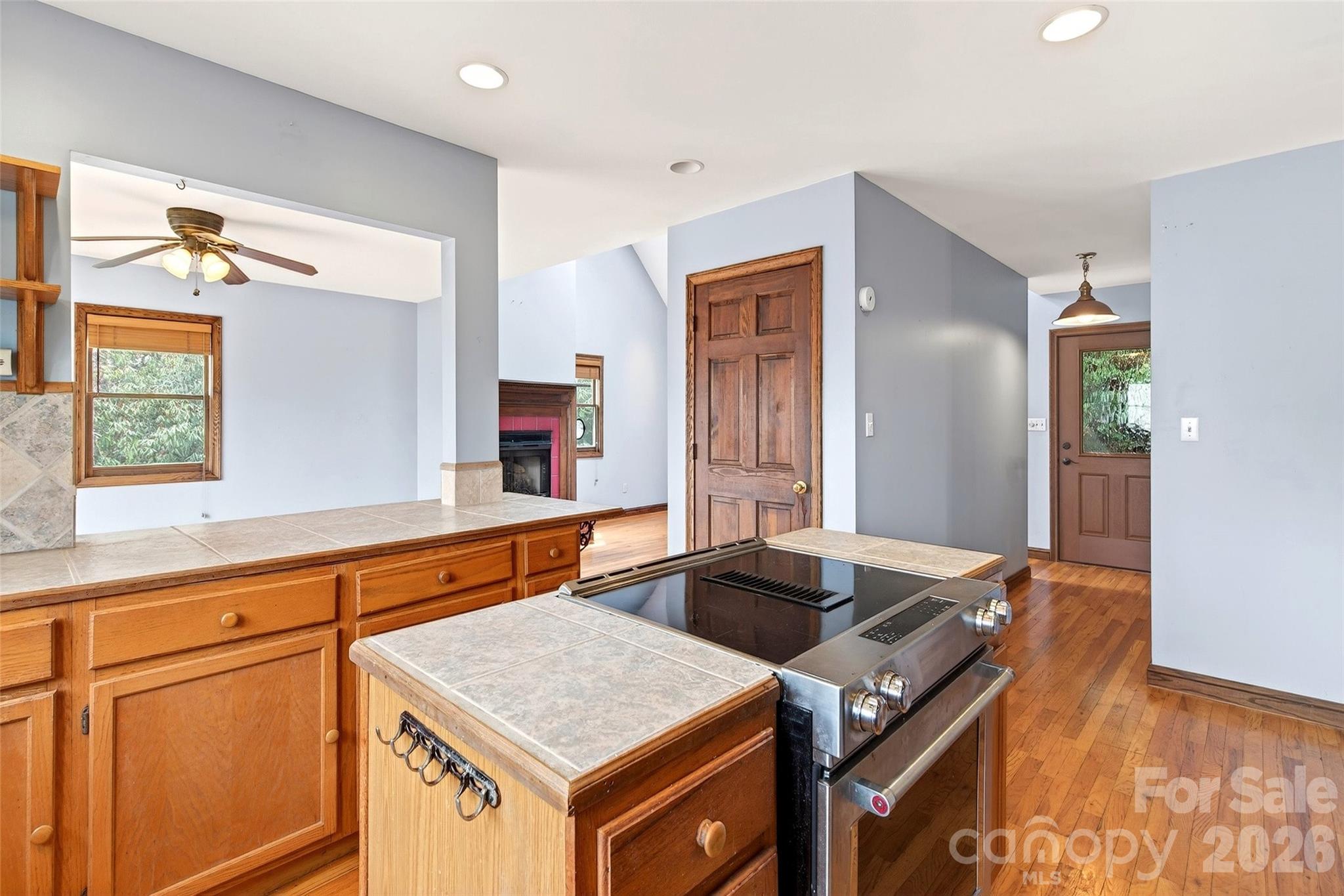 169 Hilltop Road Black Mountain, NC 28711 - Photo 22 of 48 a kitchen that has a cabinets and a table in it