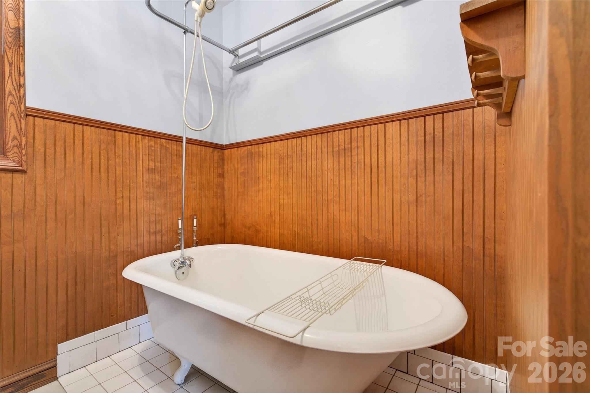 169 Hilltop Road Black Mountain, NC 28711 - Photo 24 of 48 a bathroom with a white bath tub and shower curtain