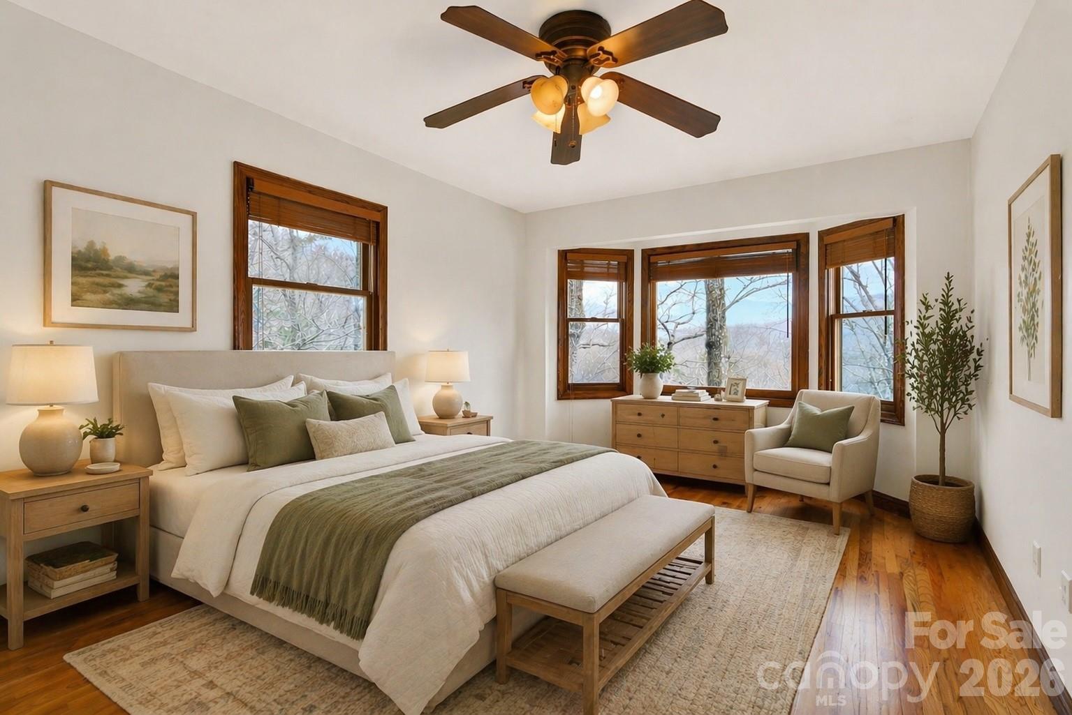 169 Hilltop Road Black Mountain, NC 28711 - Photo 25 of 48 a spacious bedroom with a bed and a large window