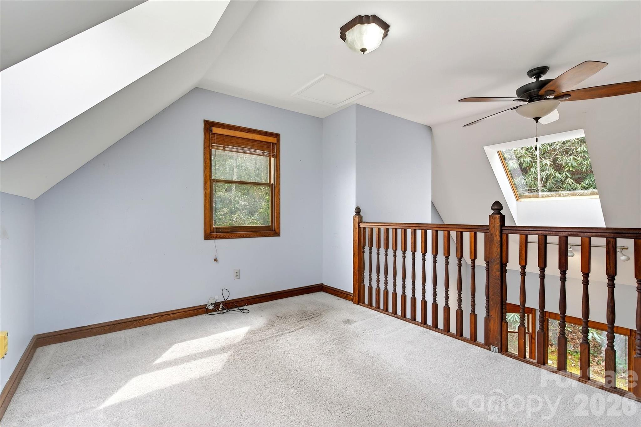 169 Hilltop Road Black Mountain, NC 28711 - Photo 31 of 48 a view of an empty room with a window