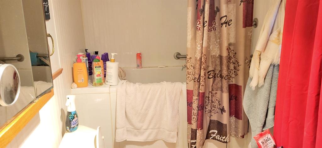 5427 Fm 69 Como, TX 75431 - Photo 10 of 38 a bathroom with a bathtub and shower