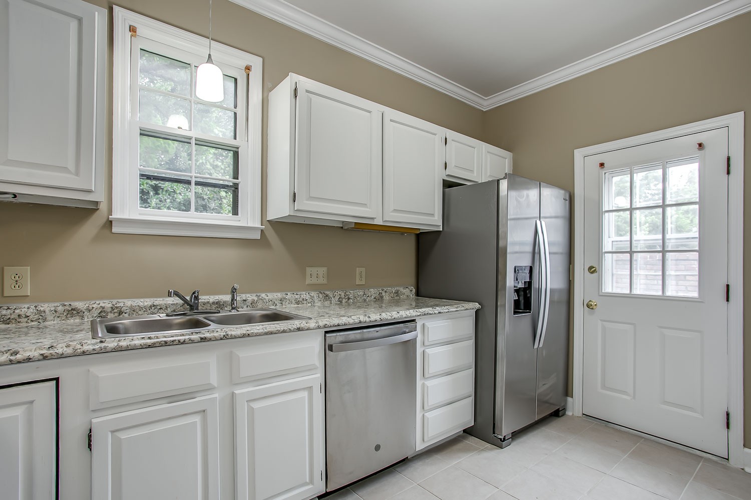 1129 West Main Street, Unit 1 Franklin, TN 37064 - Photo 12 of 30 a kitchen with stainless steel appliances granite countertop a refrigerator sink and cabinets