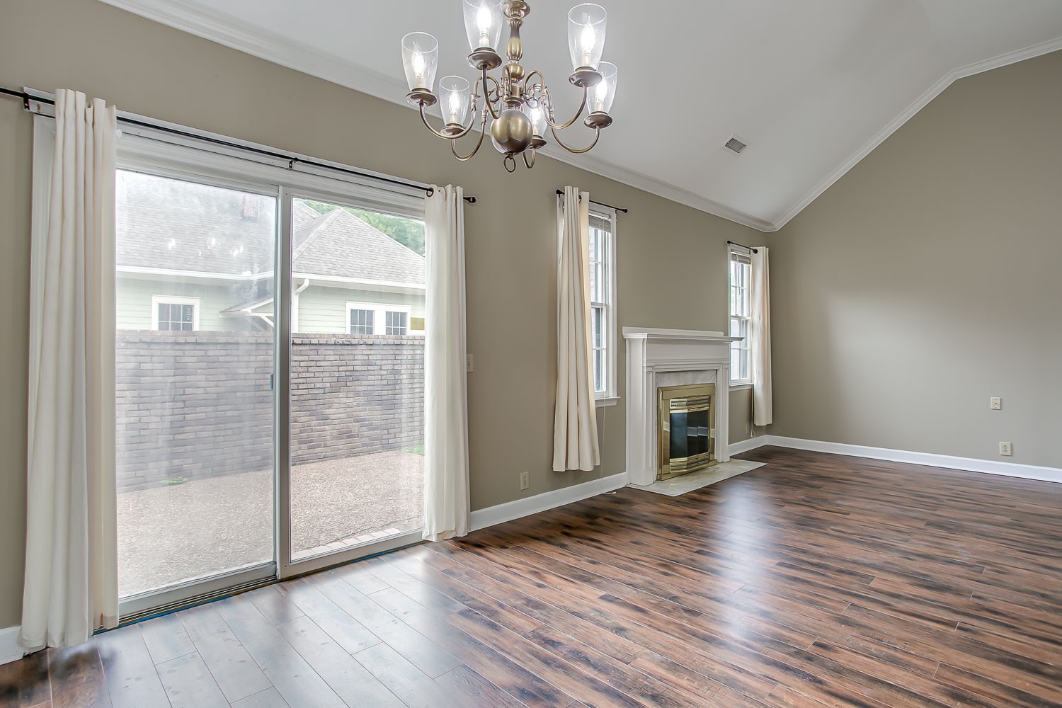1129 West Main Street, Unit 1 Franklin, TN 37064 - Photo 13 of 30 a view of a livingroom with wooden floor a ceiling fan and windows