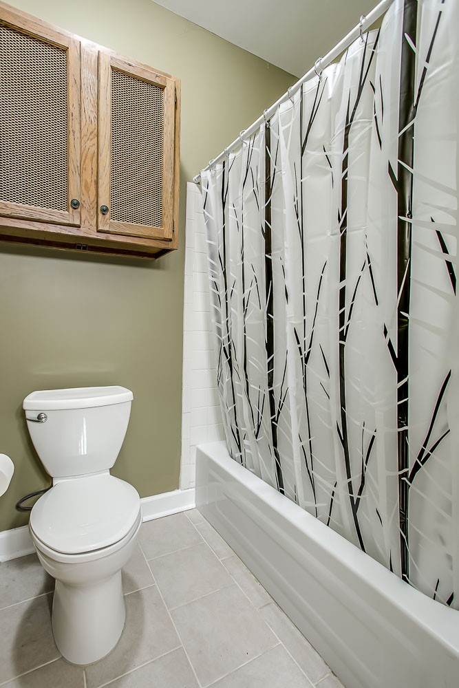 1129 West Main Street, Unit 1 Franklin, TN 37064 - Photo 21 of 30 a bathroom with a toilet and a shower