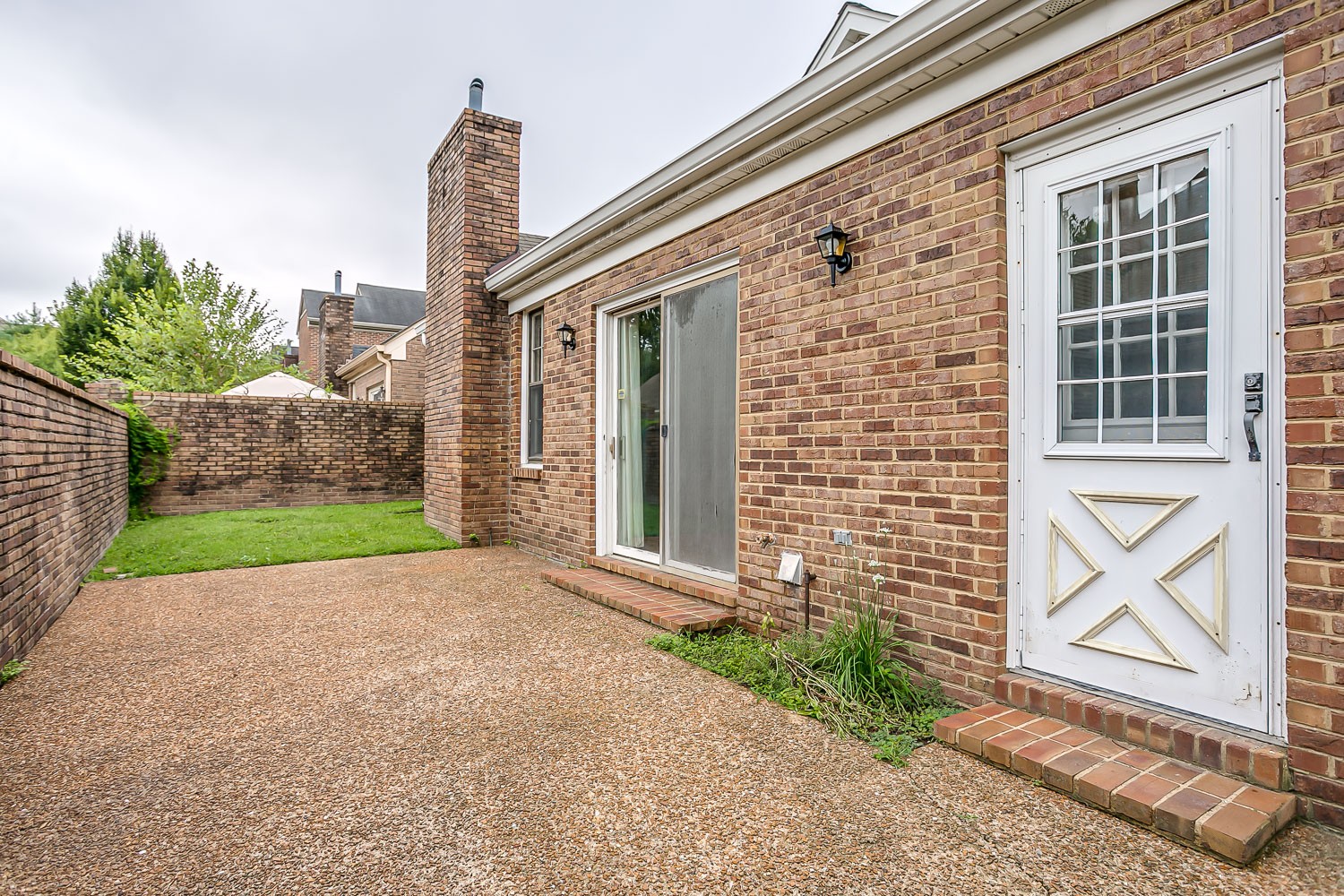 1129 West Main Street, Unit 1 Franklin, TN 37064 - Photo 23 of 30 a view of a brick house with a yard