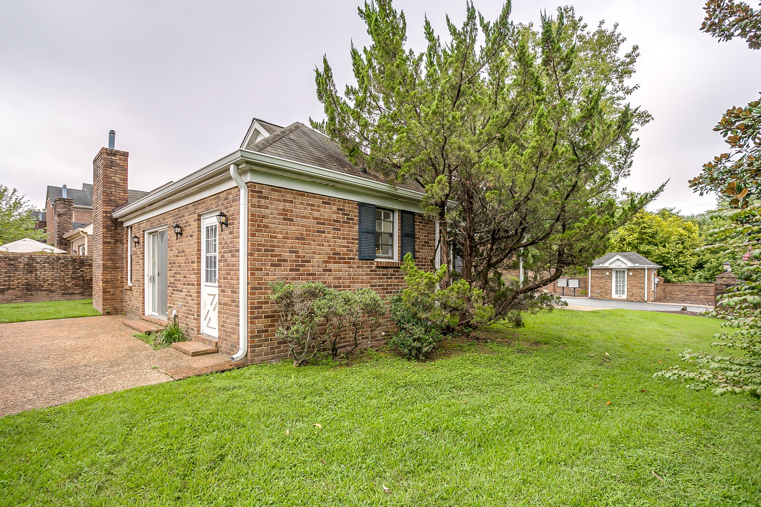 1129 West Main Street, Unit 1 Franklin, TN 37064 - Photo 26 of 30 a front view of a house with a yard