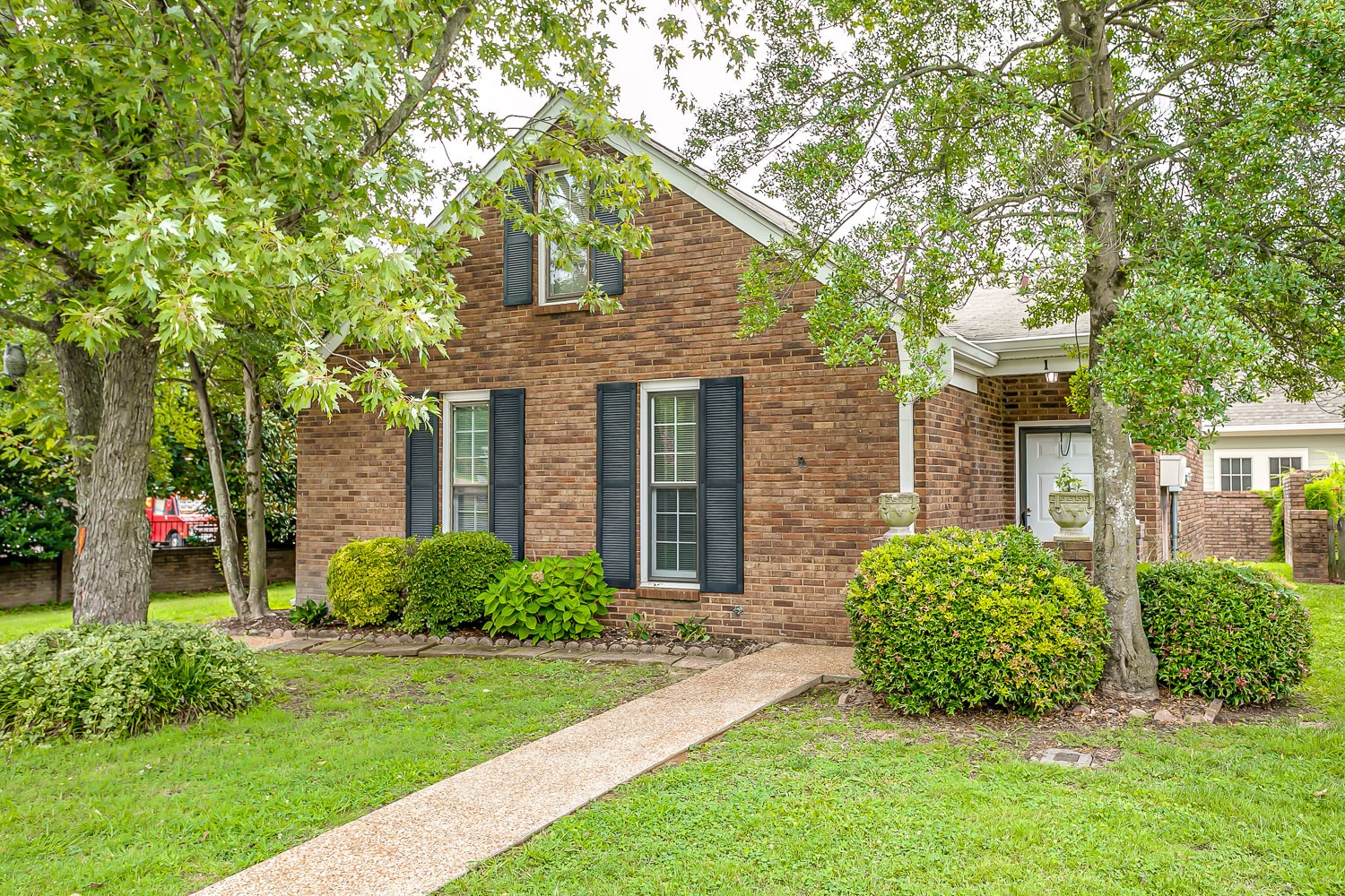 1129 West Main Street, Unit 1 Franklin, TN 37064 - Photo 3 of 30 a view of a house with a yard and plants