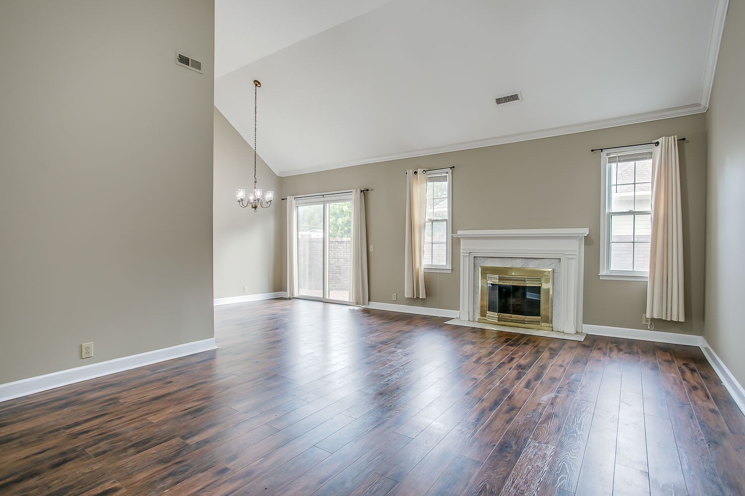 1129 West Main Street, Unit 1 Franklin, TN 37064 - Photo 6 of 30 an empty room with wooden floor fireplace and windows