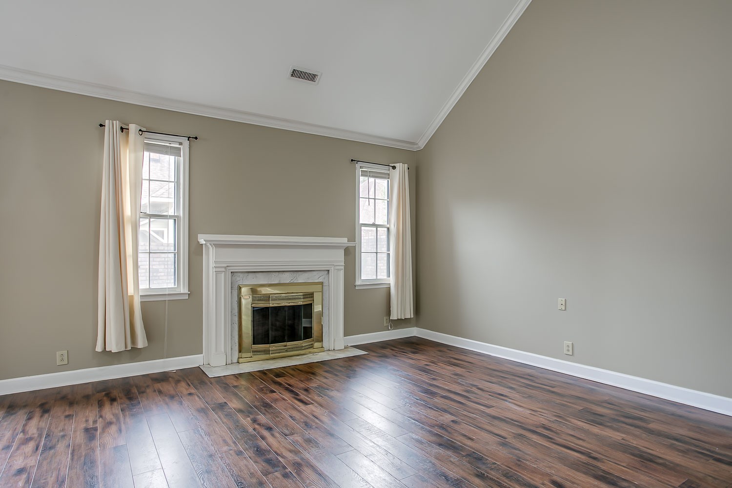 1129 West Main Street, Unit 1 Franklin, TN 37064 - Photo 8 of 30 an empty room with wooden floor fireplace and windows