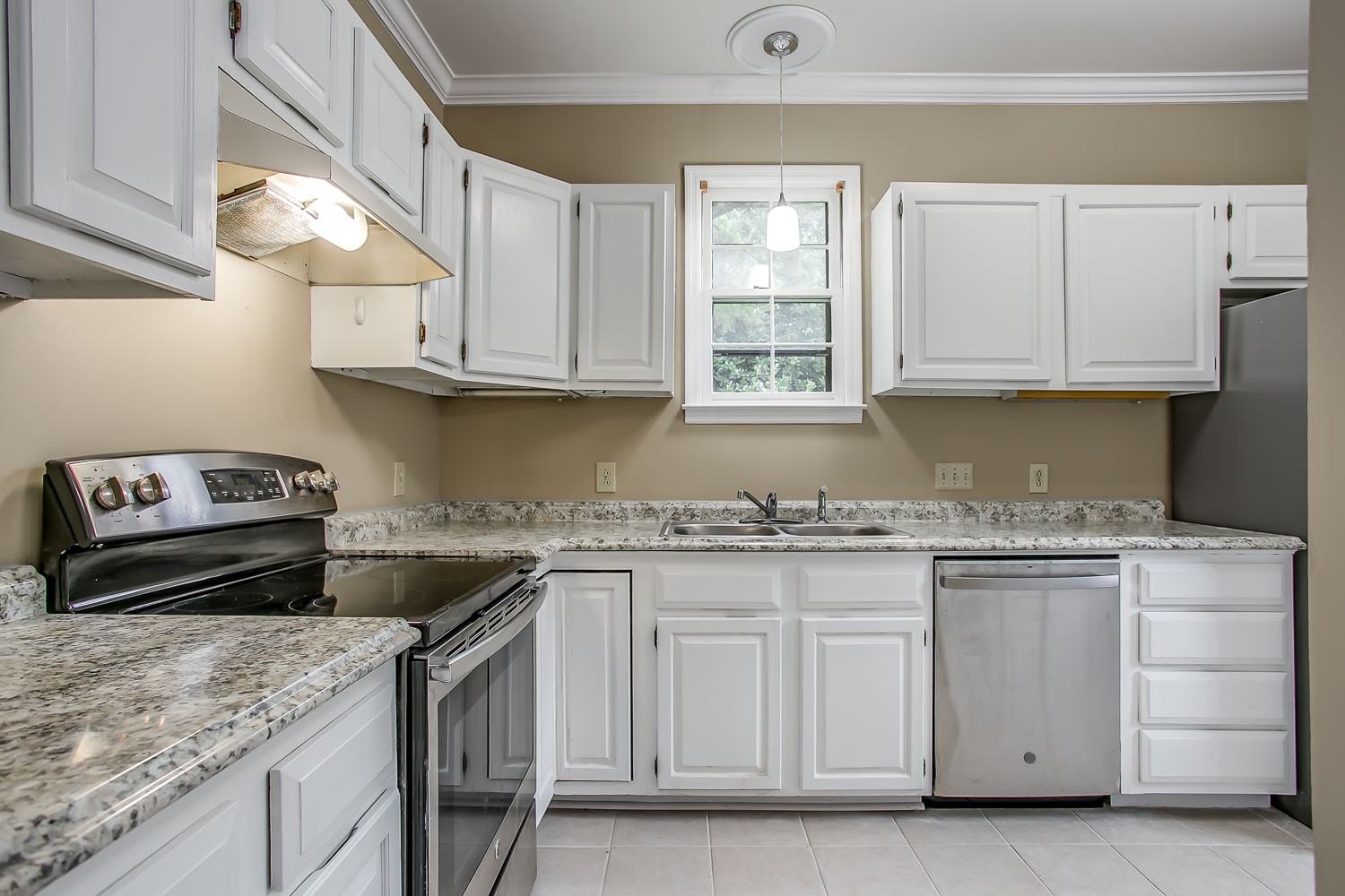 1129 West Main Street, Unit 1 Franklin, TN 37064 - Photo 9 of 30 a kitchen with granite countertop white cabinets and a stove