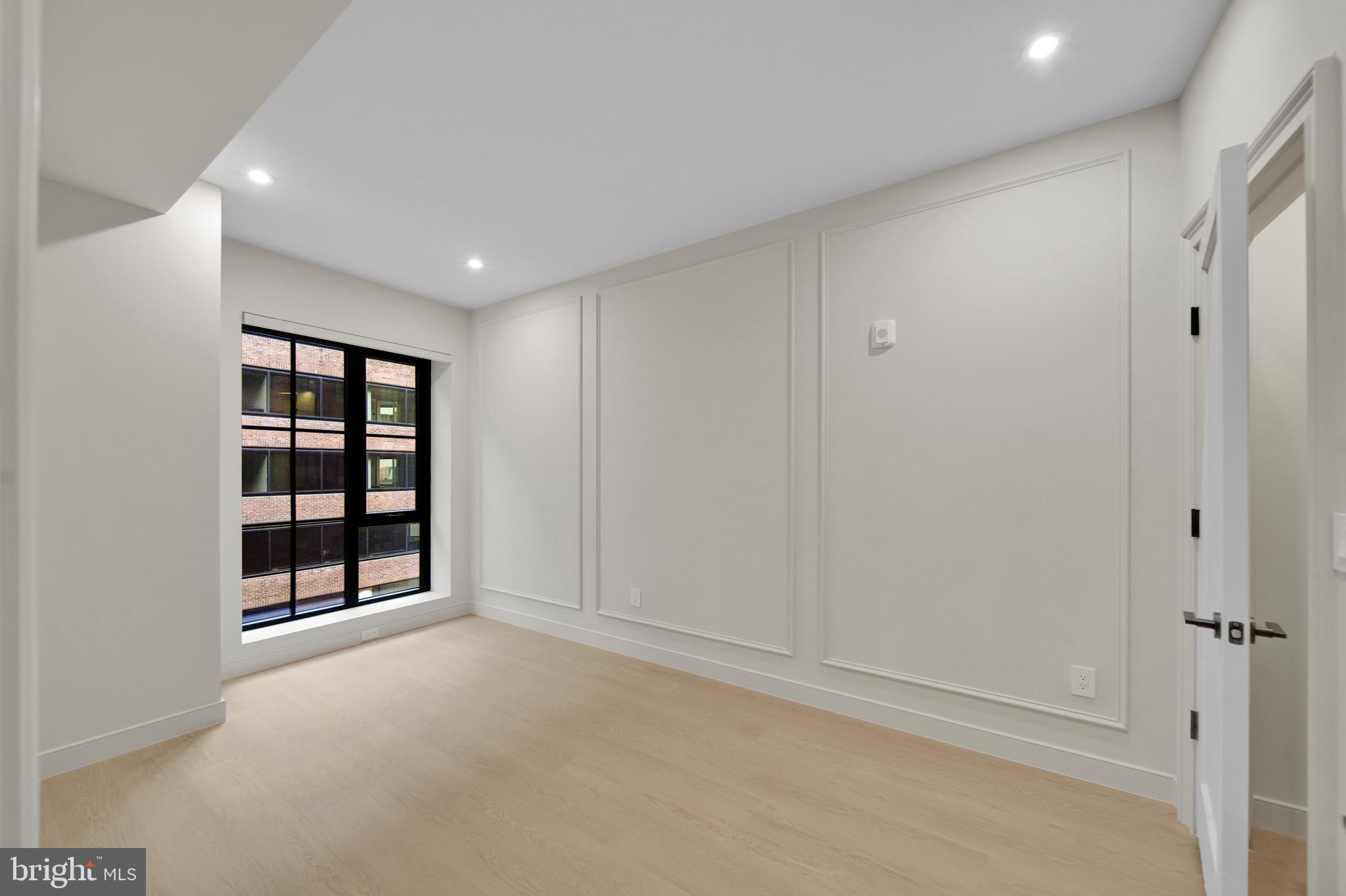 2121 Ward Place Northwest, Unit 405 Washington, DC 20037 - Photo 8 of 18 a view of an empty room with a window