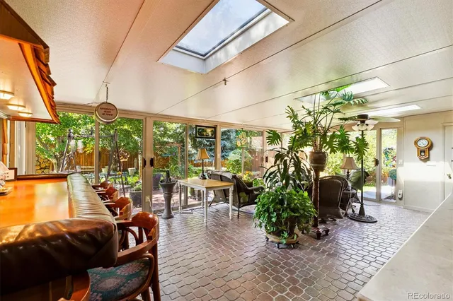 a living room filled with furniture and a garden