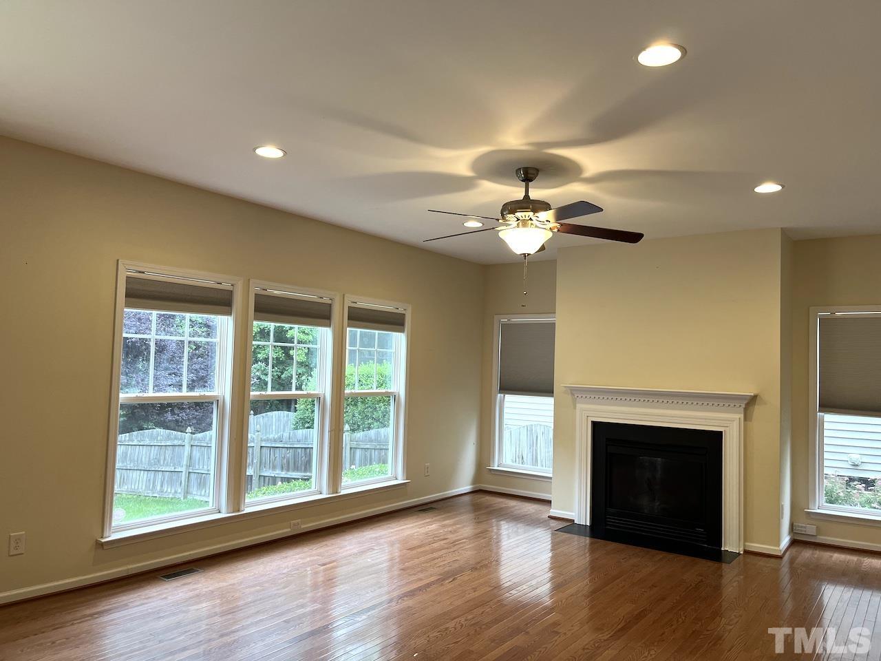 2 Greenway Circle Durham, NC 27705 - Photo 10 of 27 a view of a livingroom with a fireplace and wooden floor