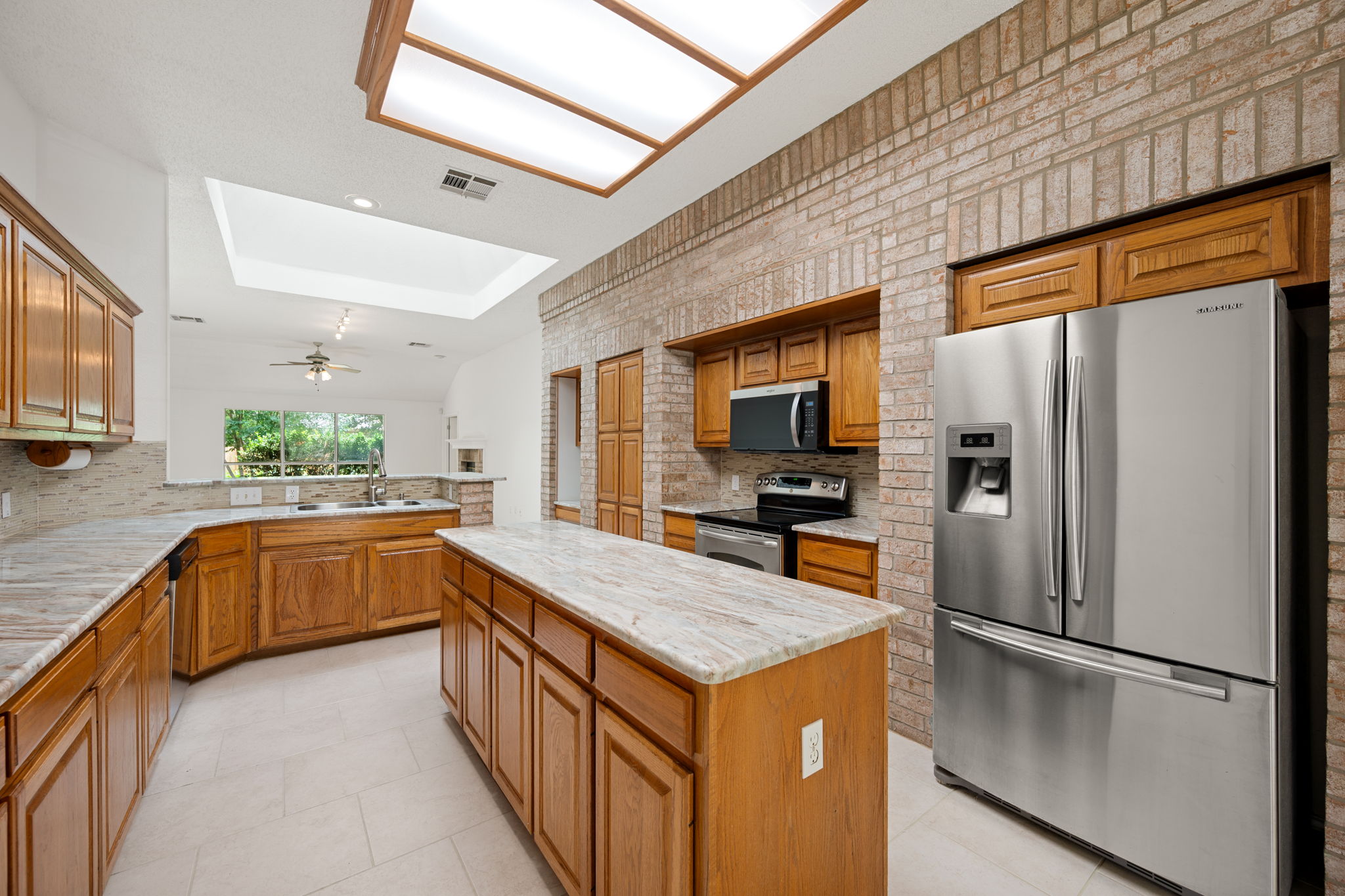 707 Ridge View Drive Leander, TX 78641 - Photo 13 of 40 a kitchen with stainless steel appliances a refrigerator and a stove