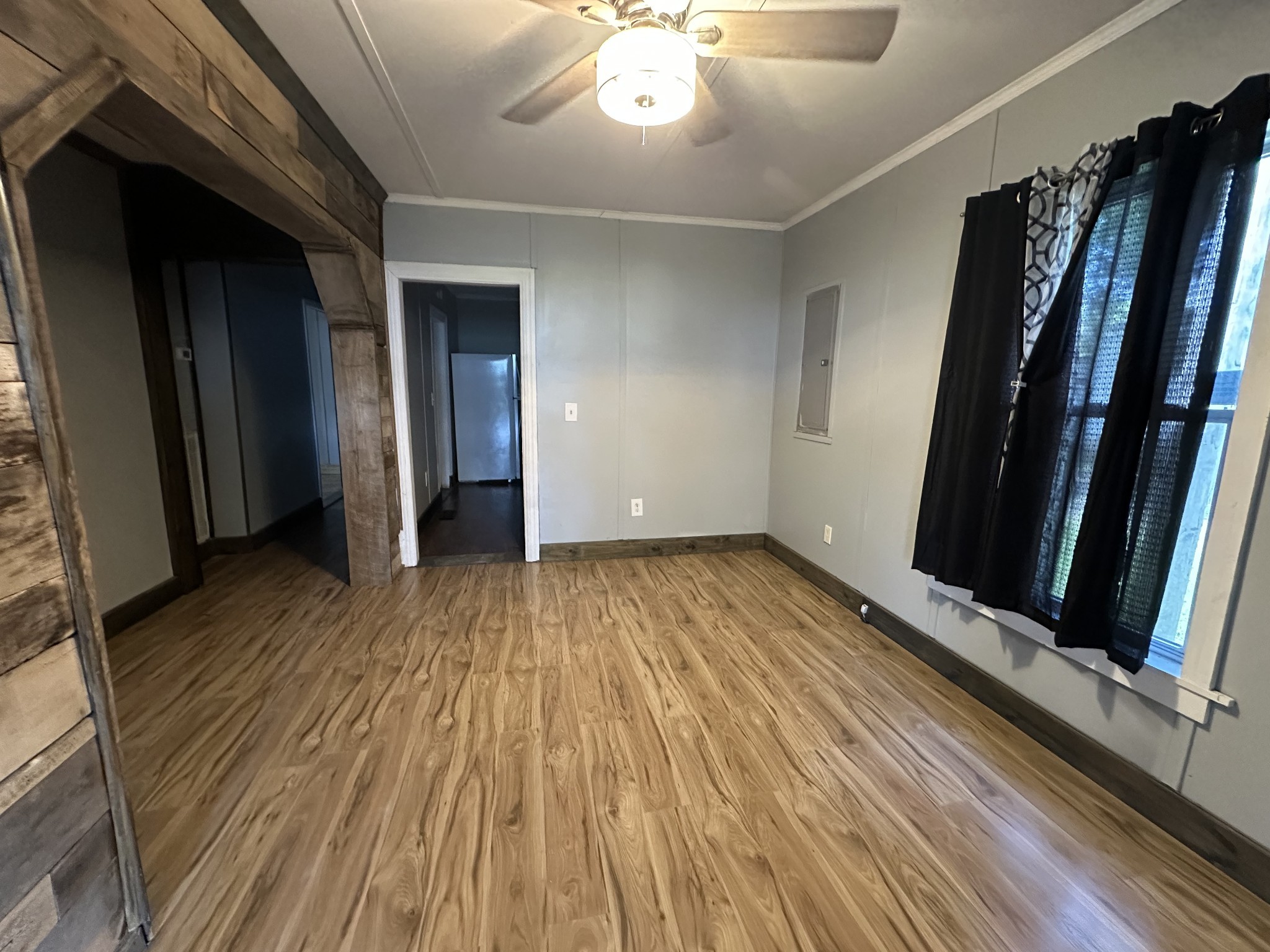 734 Childers Street Pulaski, TN 38478 - Photo 2 of 9 a view of an empty room with wooden floor