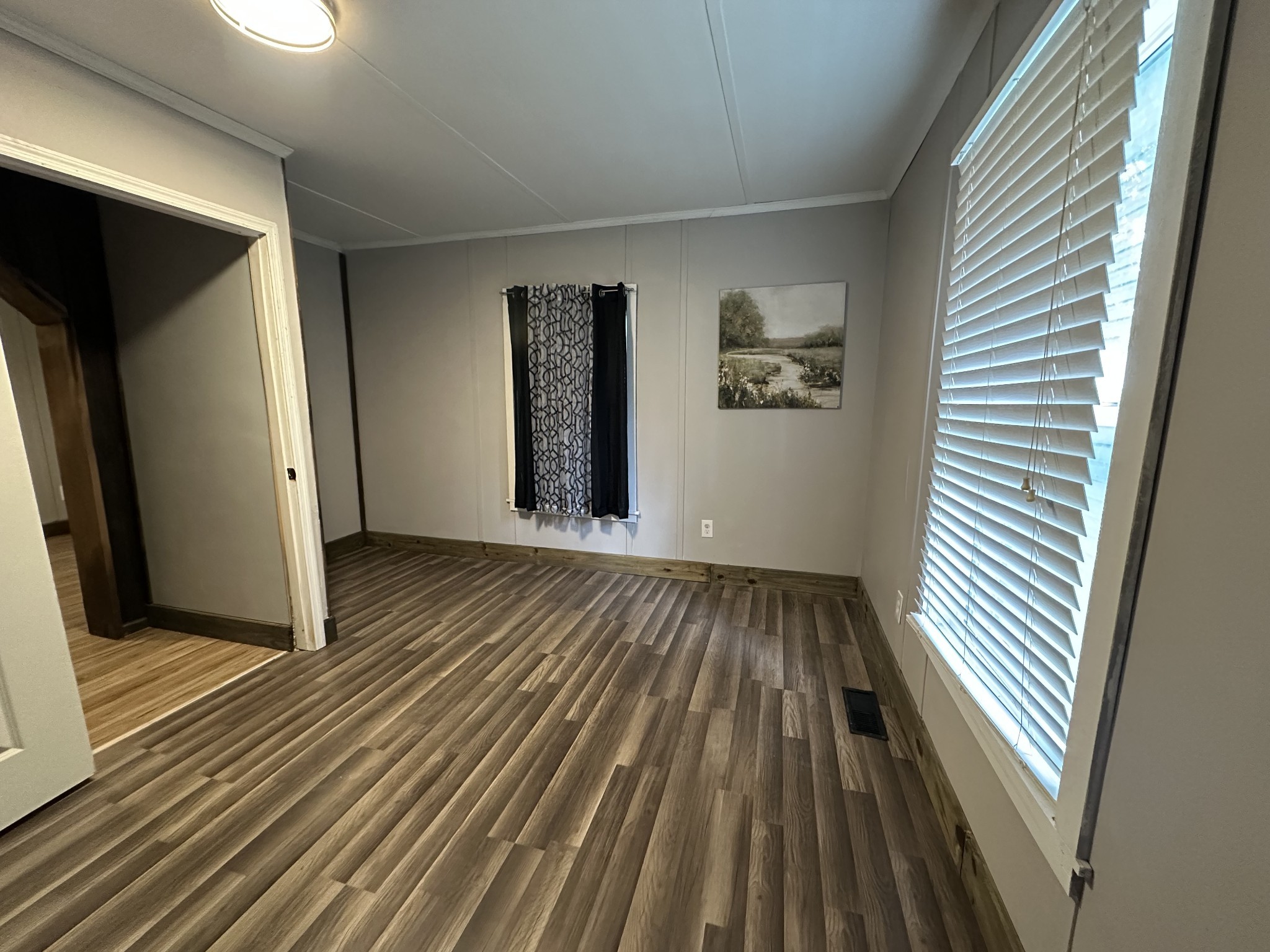 734 Childers Street Pulaski, TN 38478 - Photo 3 of 9 a view of a room with wooden floor and windows