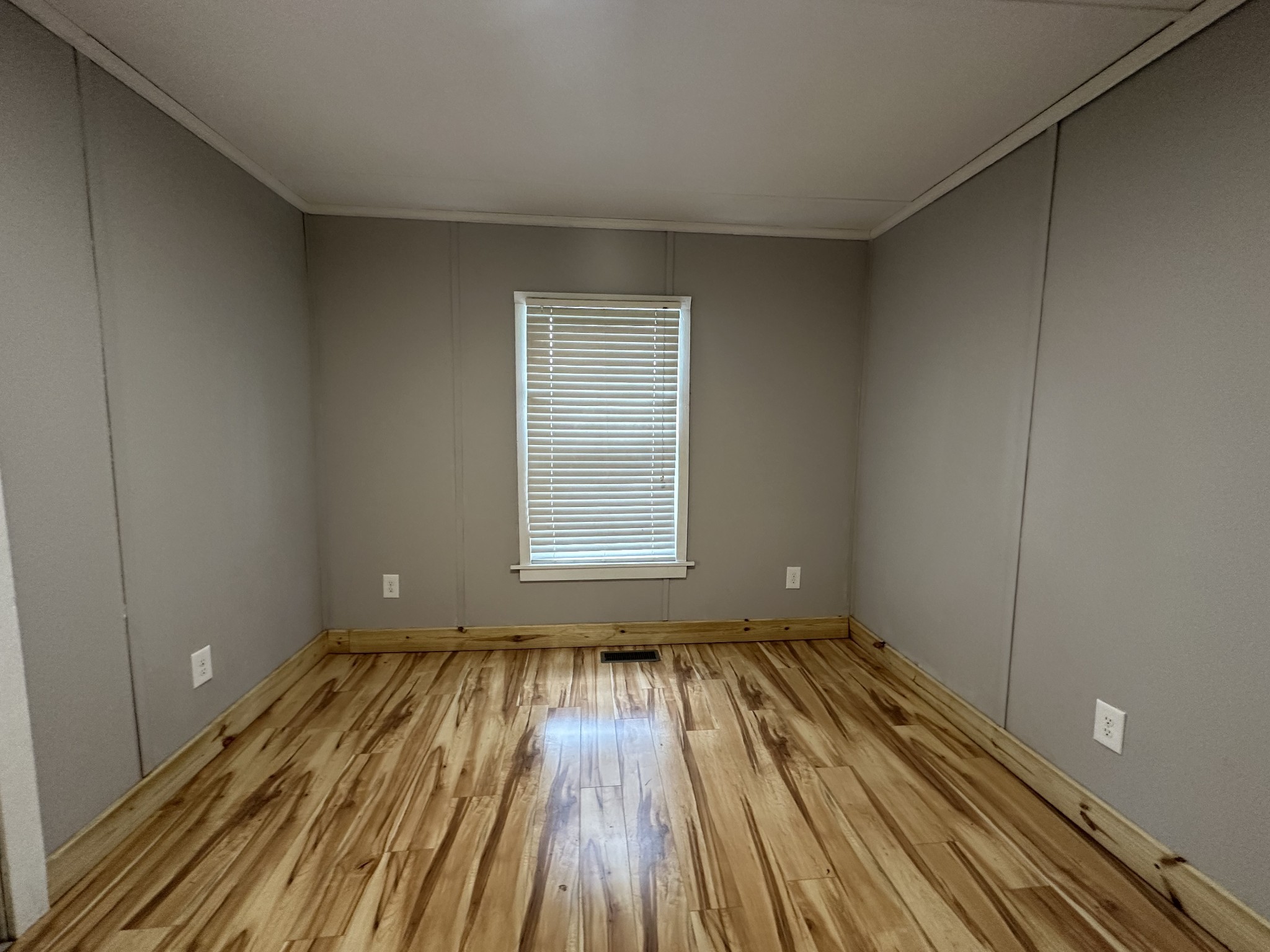 734 Childers Street Pulaski, TN 38478 - Photo 5 of 9 a view of wooden floor in a room