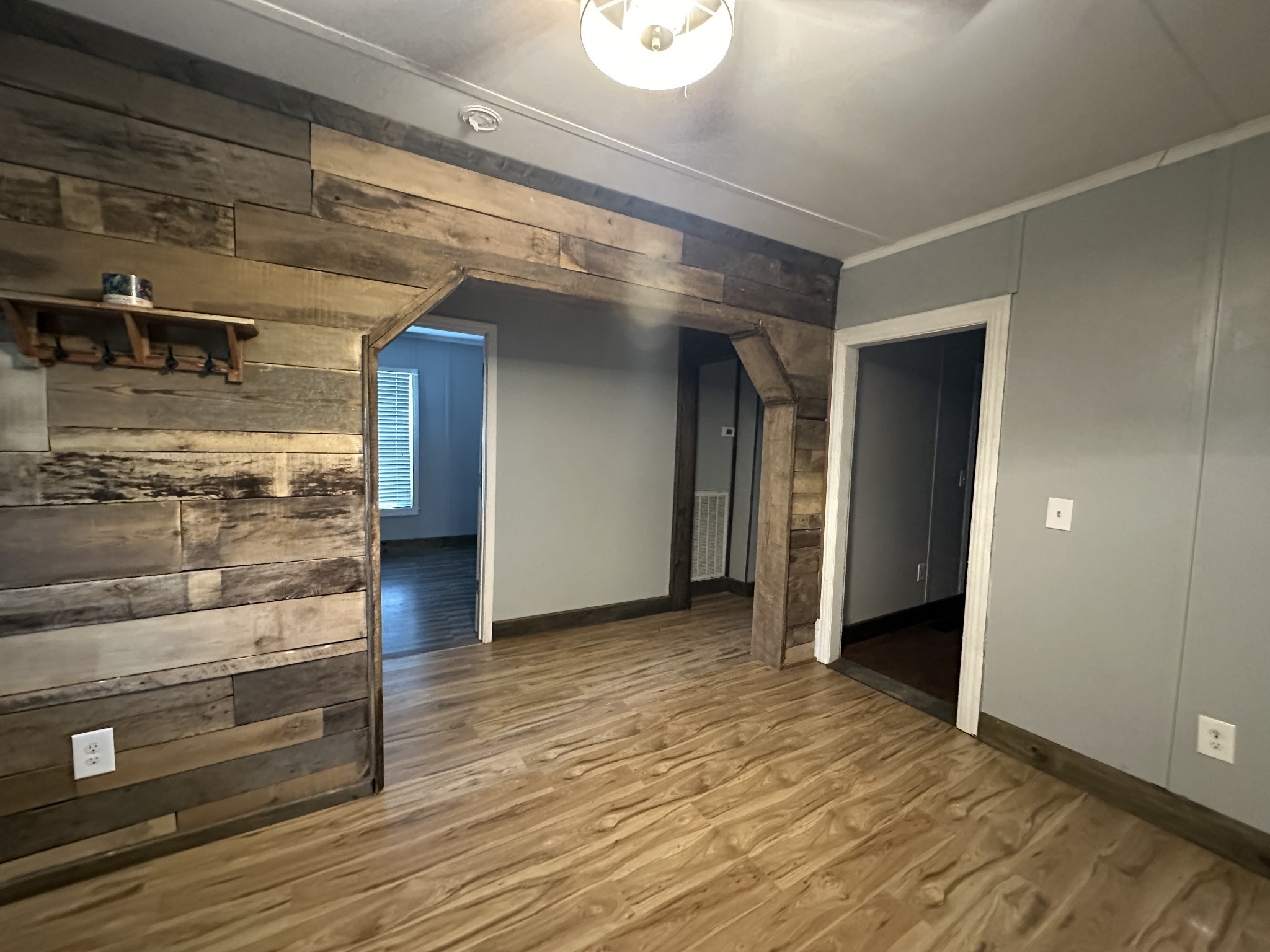 734 Childers Street Pulaski, TN 38478 - Photo 9 of 9 a view of an empty room and wooden floor