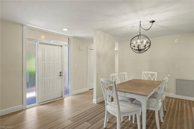 a view of a dining table and chairs in a room