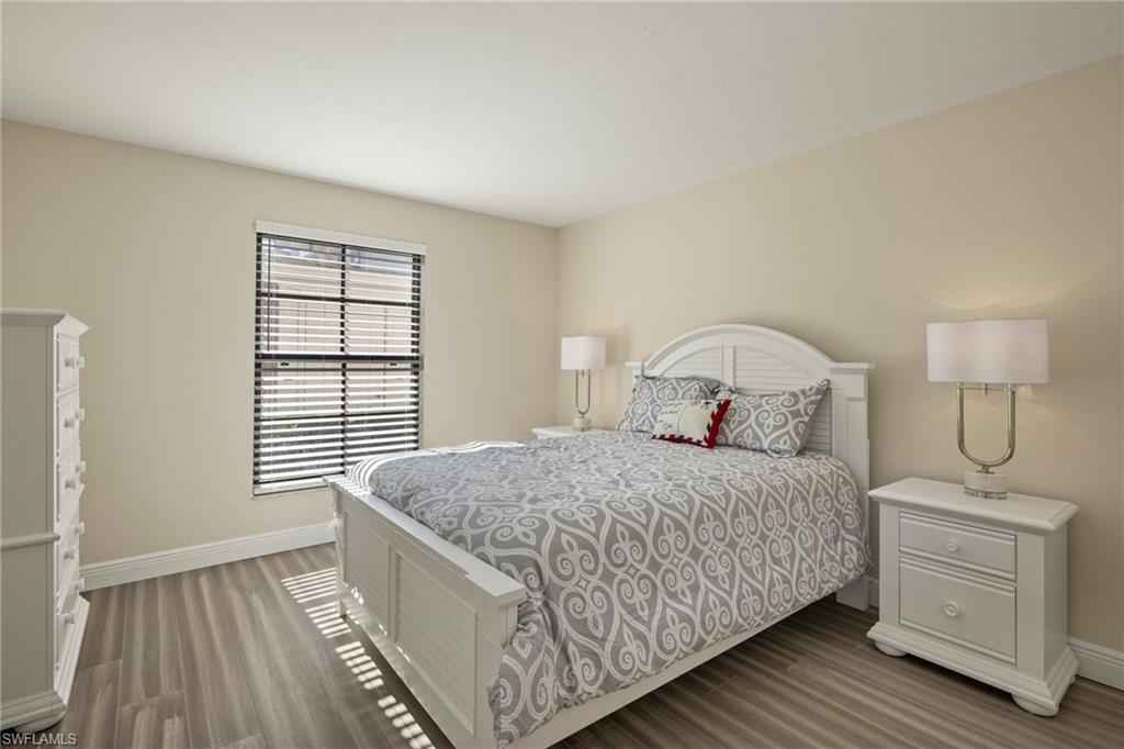 3101 Riviera Drive Naples, FL 34103 - Photo 17 of 41 a bedroom with a bed and a window