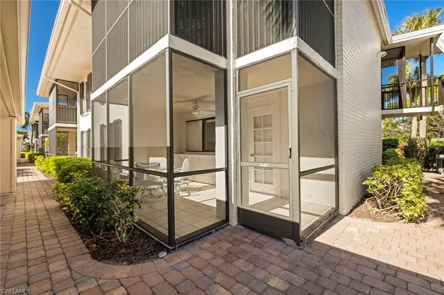 a view of a balcony with potted plants