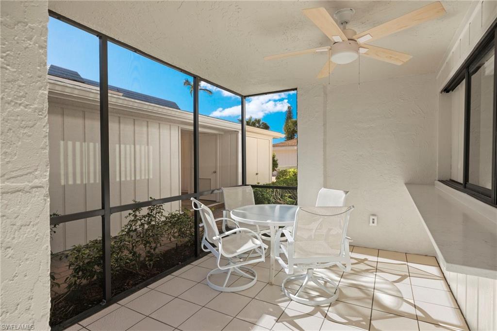 3101 Riviera Drive Naples, FL 34103 - Photo 22 of 41 a view of a livingroom with furniture and a floor to ceiling window