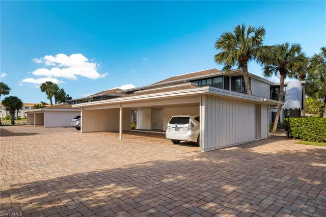 a view of a house with a yard and garage