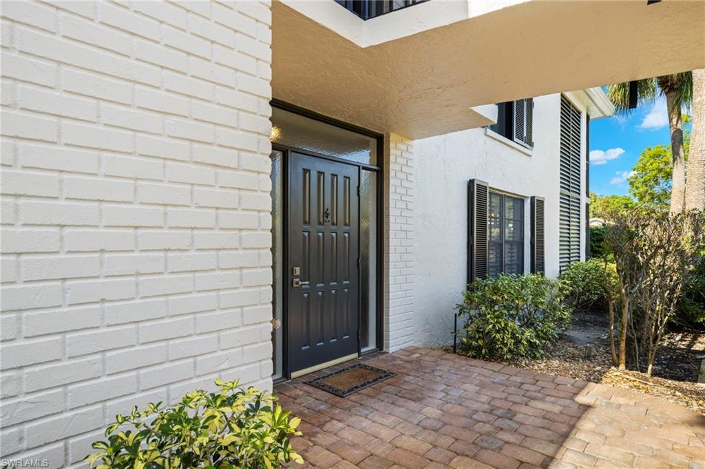 3101 Riviera Drive Naples, FL 34103 - Photo 27 of 41 a view of entryway and hall