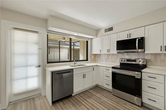 a kitchen with a stove and a sink