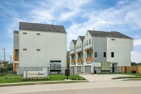a view of house with backyard