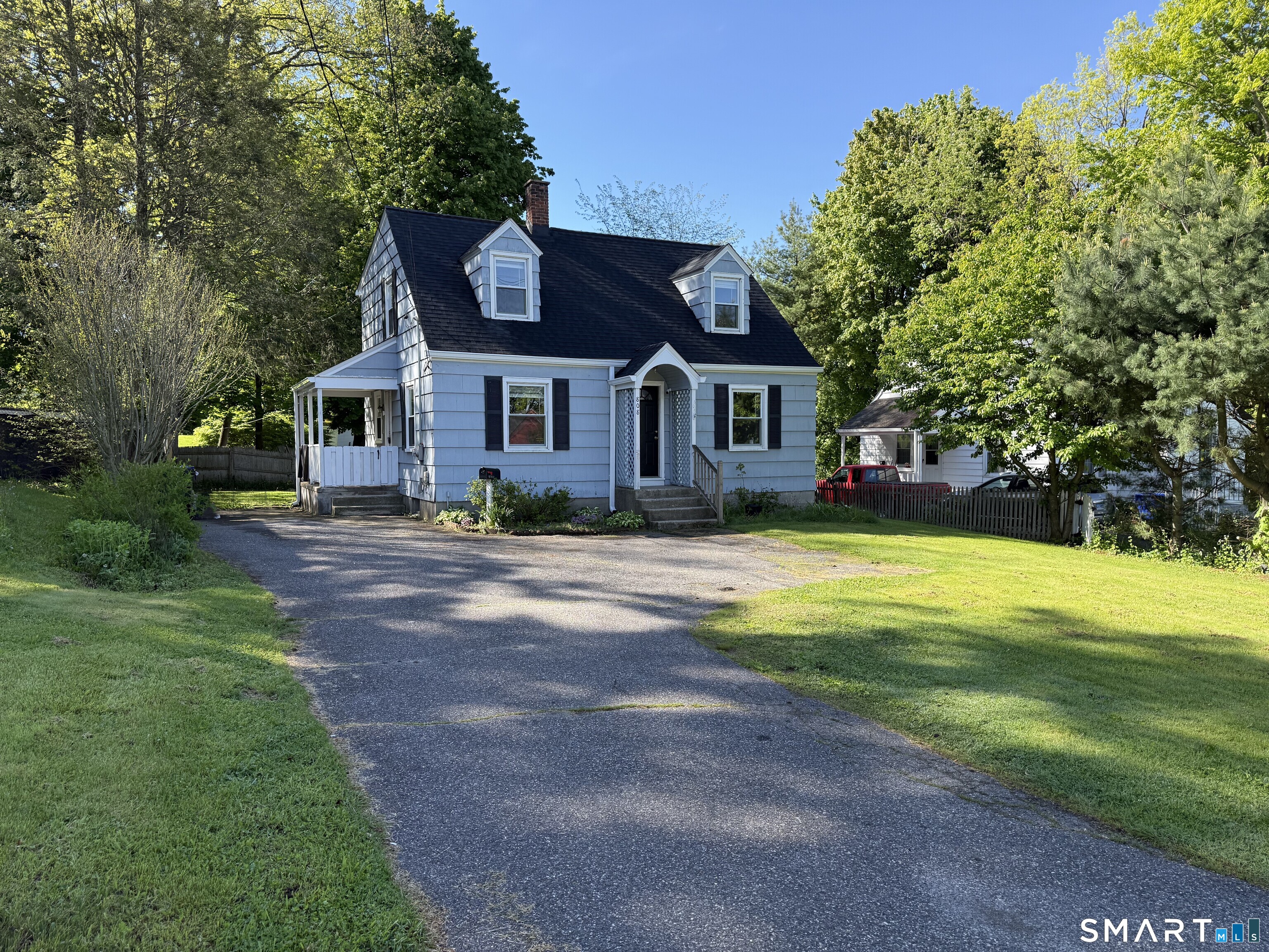 808 East Main Street Torrington, CT 06790 - Photo 2 of 40 a front view of a house with yard and green space