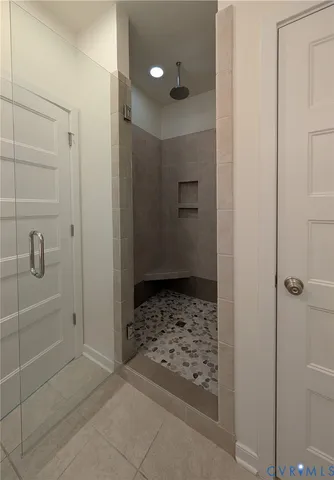 a bathroom with a shower and toilet