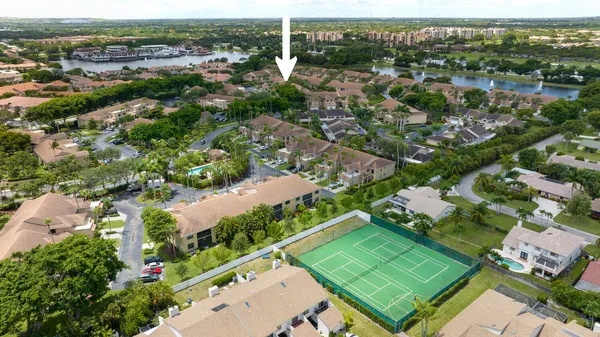 an aerial view of a house with a lake view