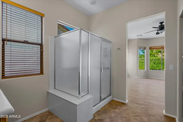 a bathroom with a shower and a sink