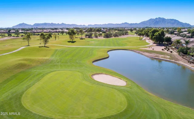 a view of a swimming pool and mountains