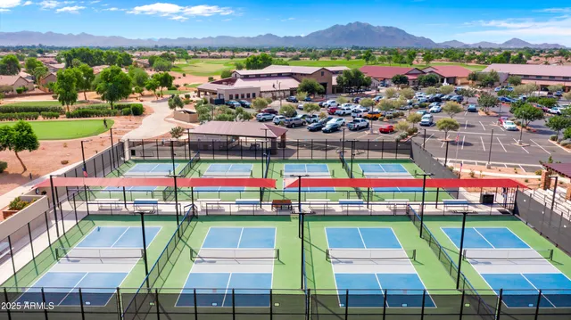 a view of swimming pool with outdoor seating and a yard