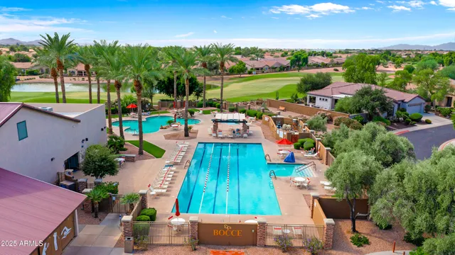 an aerial view of a house with a garden and lake view