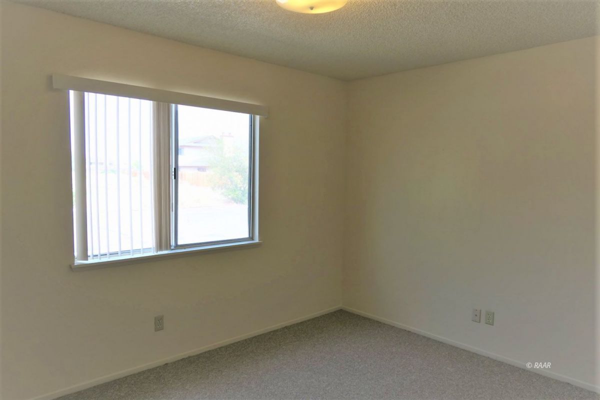 933 West Perdew Avenue Ridgecrest, CA 93555 - Photo 18 of 21 an empty room with a window