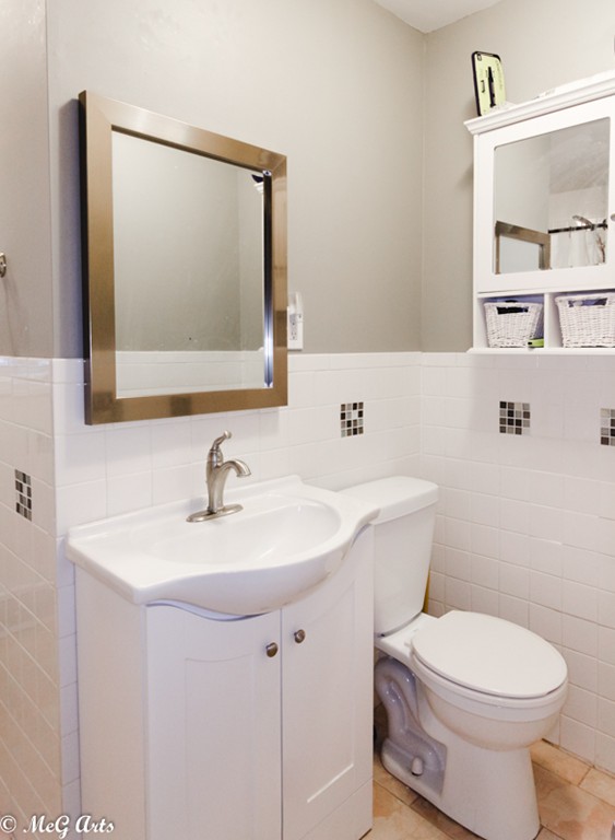 55 Lindsay Road Springfield, MA 01128 - Photo 11 of 18 a bathroom with a white sink a mirror and a toilet
