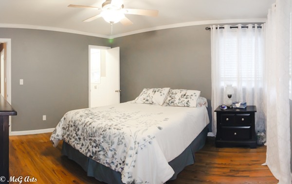 55 Lindsay Road Springfield, MA 01128 - Photo 12 of 18 a bedroom with a bed and a chandelier
