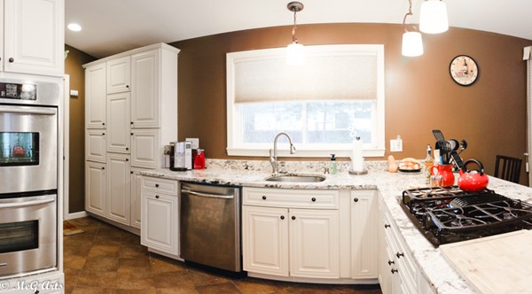 55 Lindsay Road Springfield, MA 01128 - Photo 3 of 18 a kitchen with a stove a sink and a refrigerator