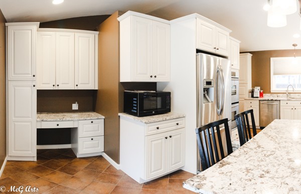 55 Lindsay Road Springfield, MA 01128 - Photo 4 of 18 a kitchen with stainless steel appliances a stove a refrigerator a sink and white cabinets