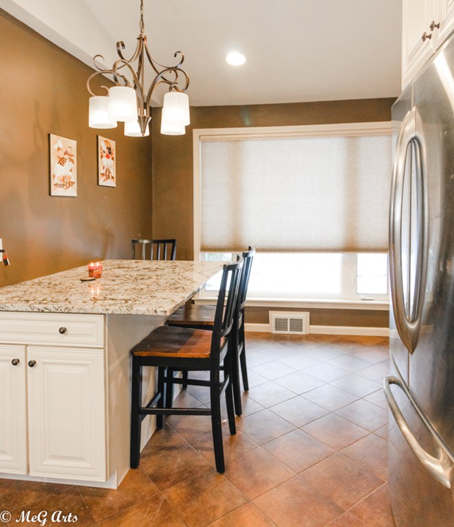 55 Lindsay Road Springfield, MA 01128 - Photo 5 of 18 a view of kitchen with granite countertop window and wooden floor