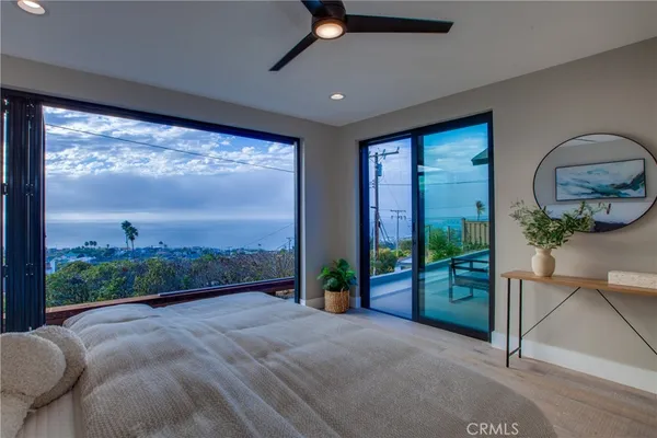 a view of a living room and a balcony