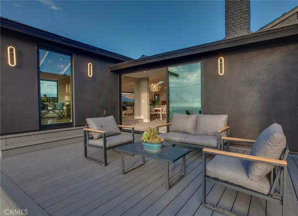 a outdoor living space with furniture and a potted plant