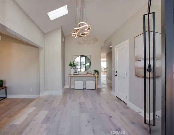 a view of a livingroom with a furniture wooden floor and a ceiling fan