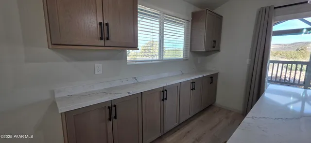 a kitchen with a refrigerator stove and microwave