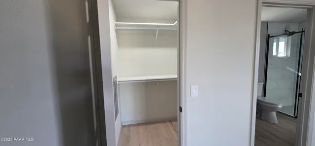 a bathroom with a shower sink and mirror